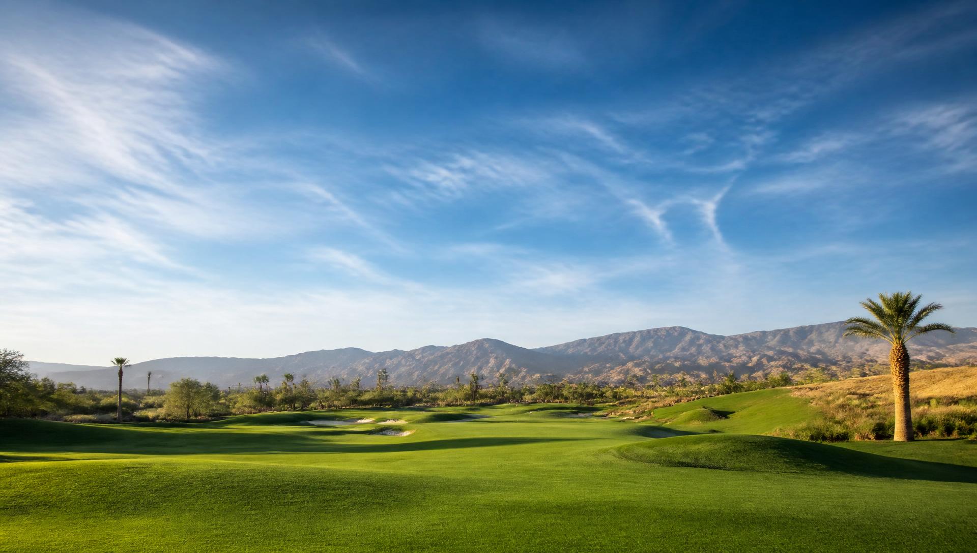Wide scenic golf course landscape under open sky